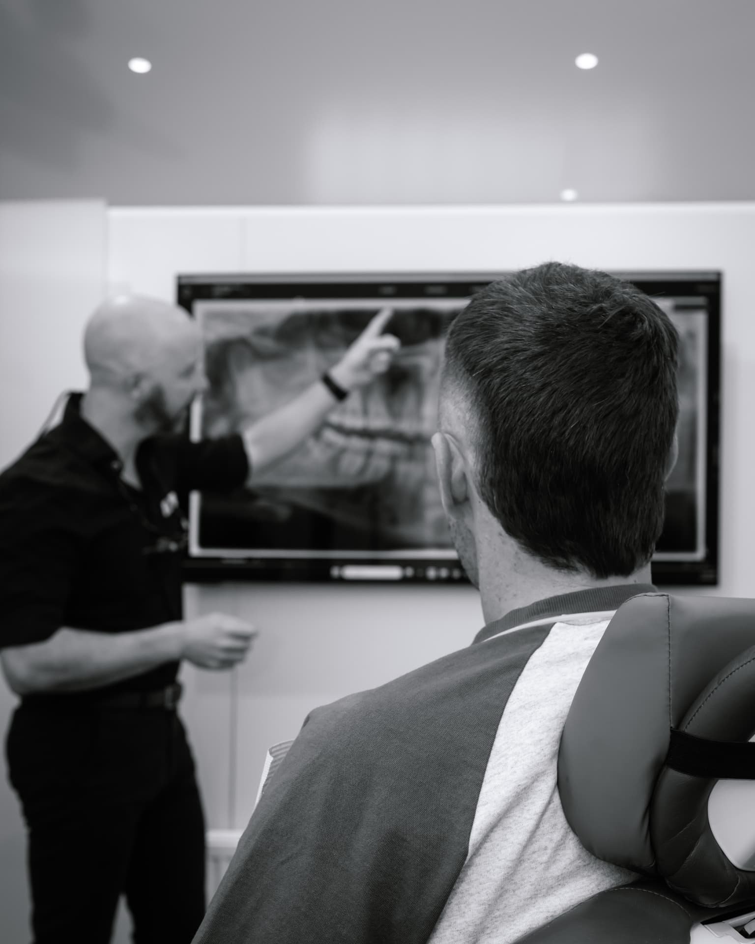 A dentist explaining digital imaging at Red Hill Dental Practice