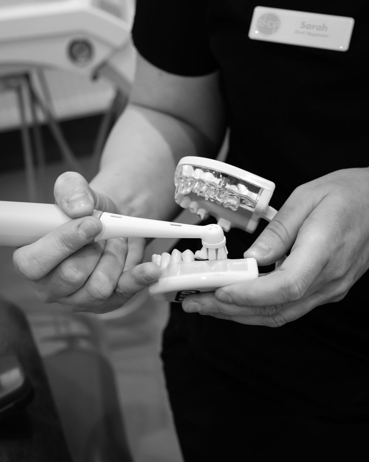 A dental model and toothbrush used to explain oral care at Red Hill Dental Practice