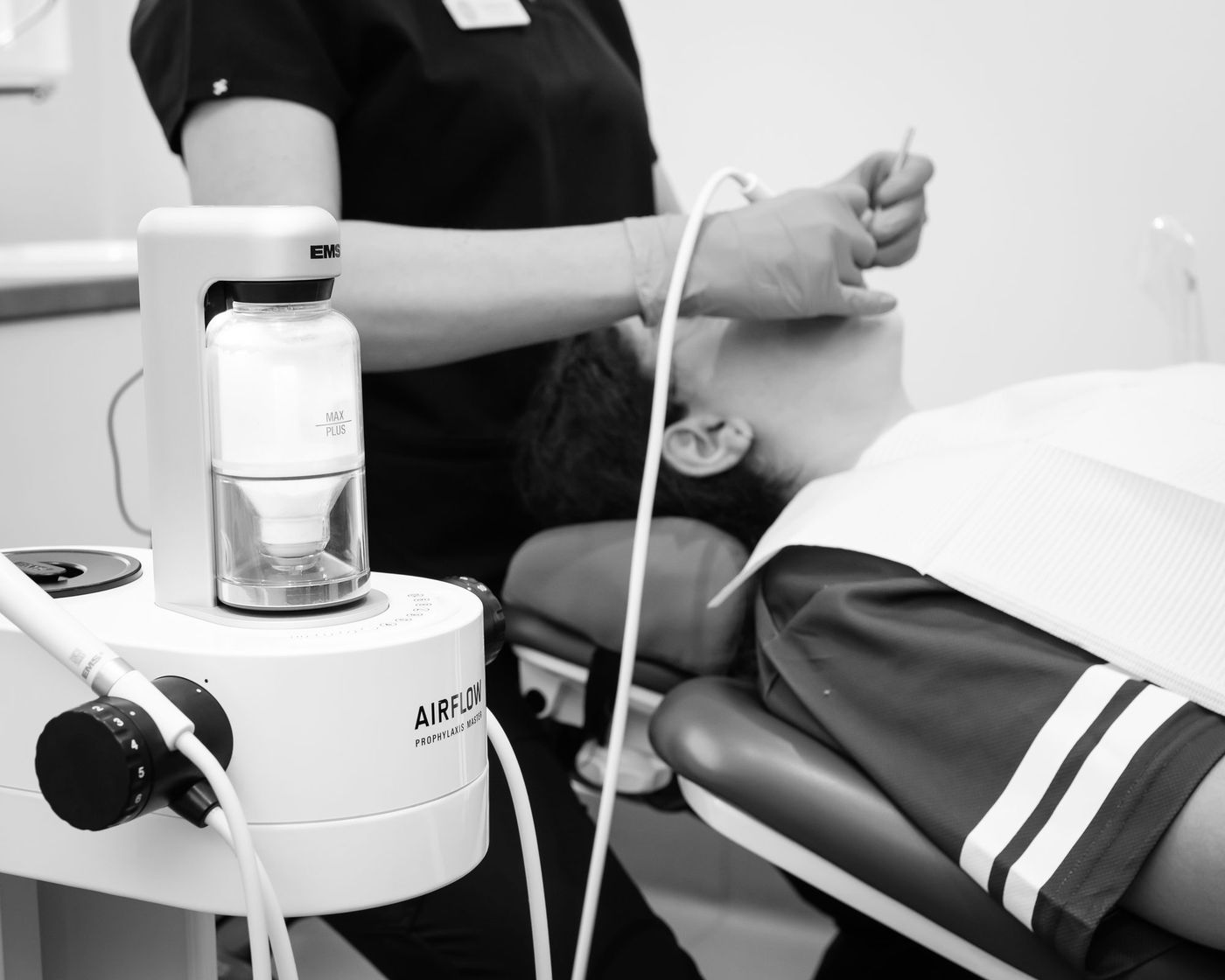 Airflow Guided Biofilm Therapy during a hygiene appointment at Red Hill Dental Practice