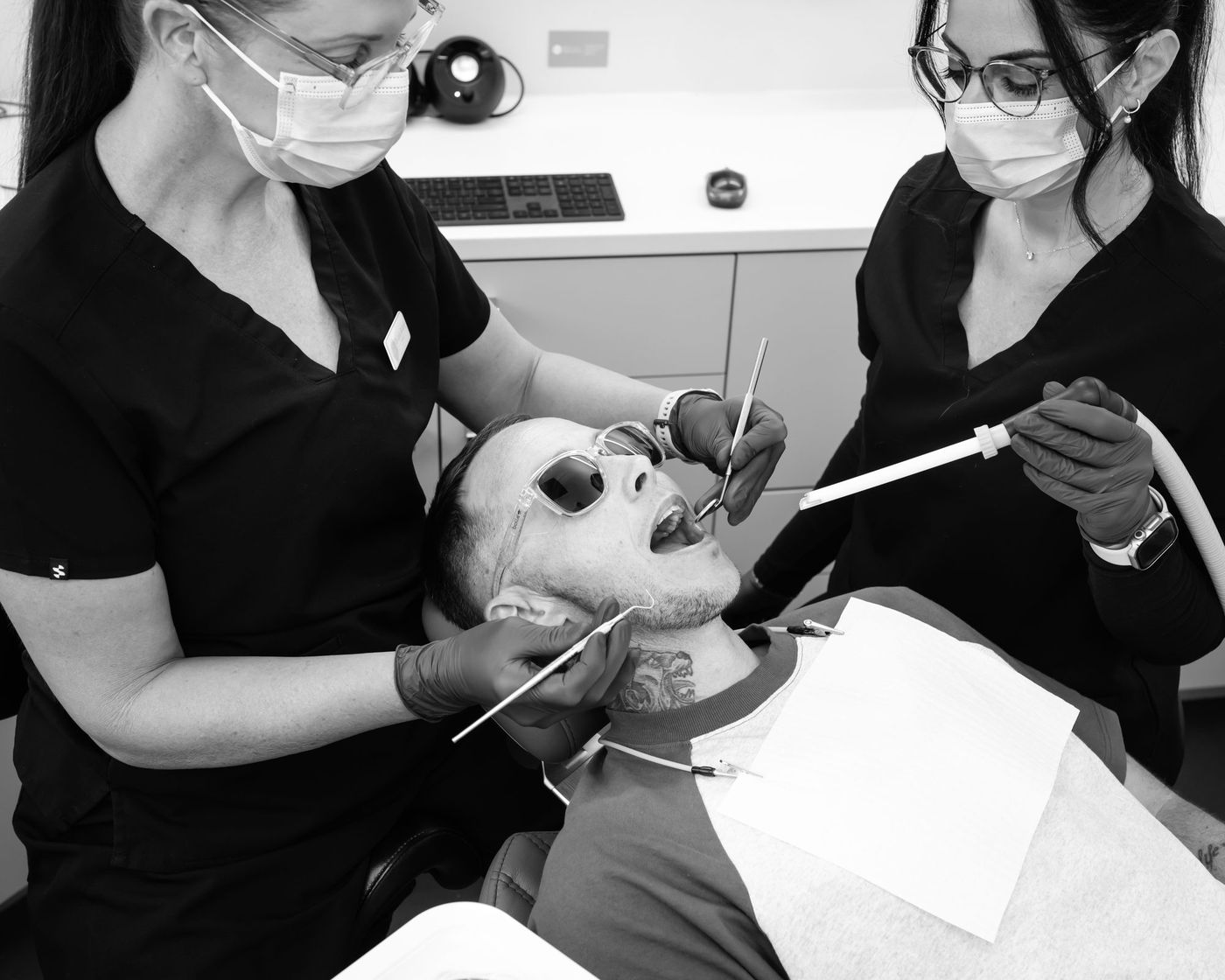 Two clinicians working together at Red Hill Dental Practice